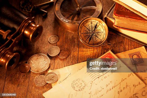 antique objects on a old wooden desk - antique spyglass stock pictures, royalty-free photos & images