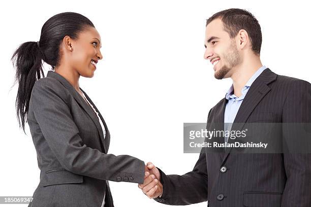 two business partners handshaking after closing a deal - business people handshake stockfoto's en -beelden