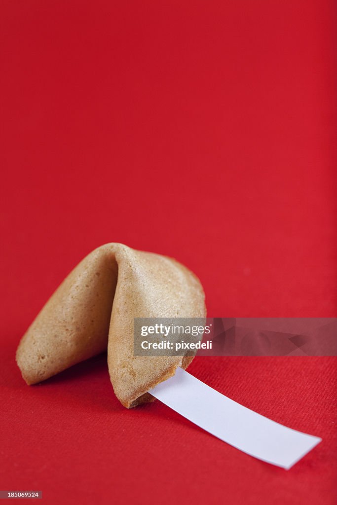 Fortune cookie on red paper