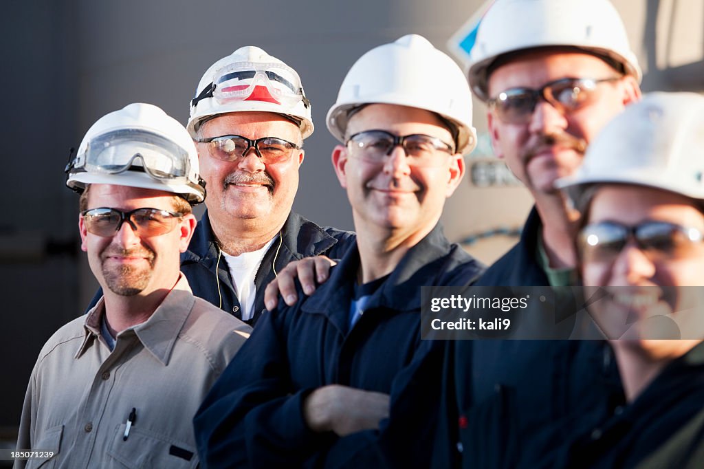 Group of industrial workers wearing hardhats