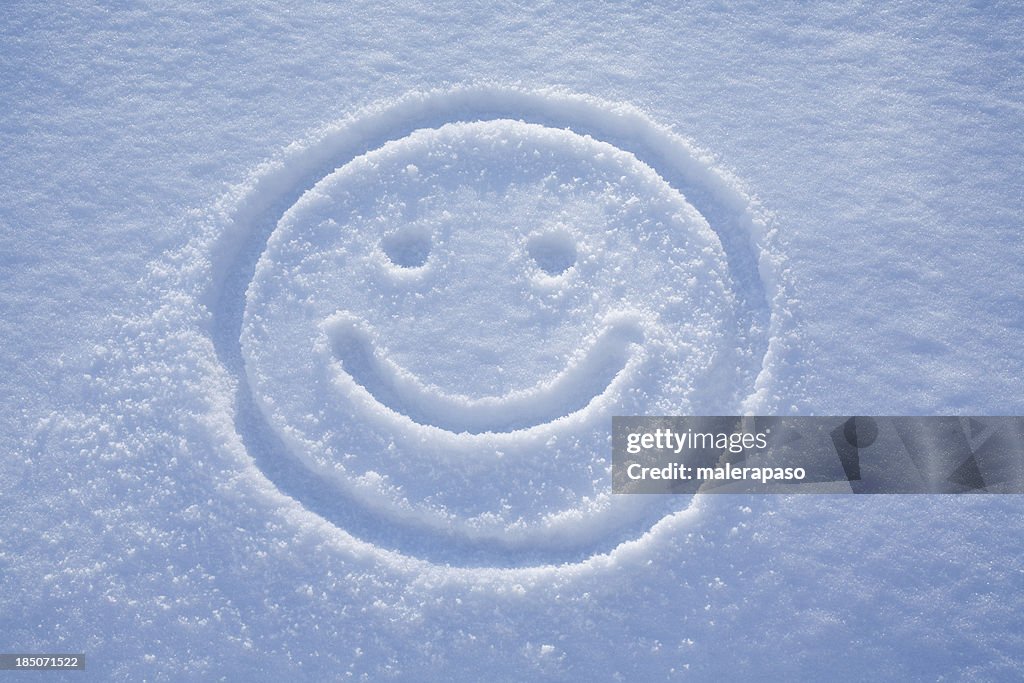 Smile. A face drawing in the snow.