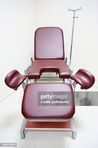 chair in a gynecologists room - birthing chair stock pictures, royalty-free photos & images