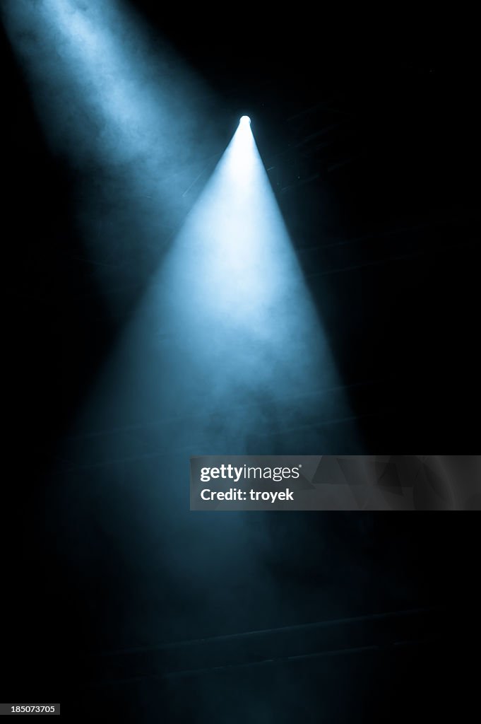 Stage Lights shining from a black background