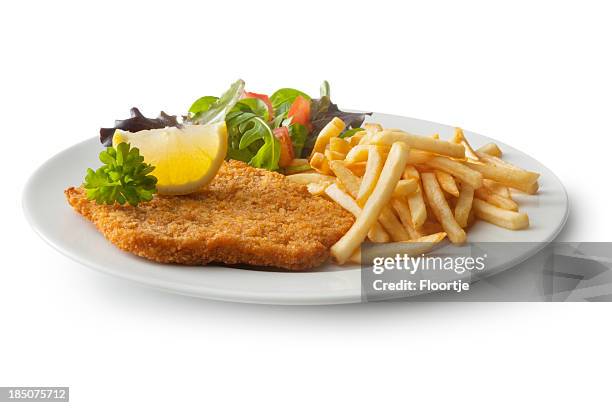 meat: schnitzel, french fries and salad - cutlet stockfoto's en -beelden