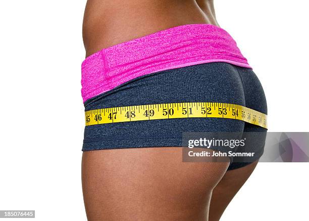 female buttocks wearing workout clothing - arse stock pictures, royalty-free photos & images