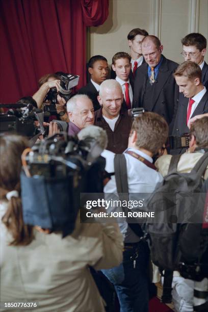 French fashion designer Jean-paul Gaultier poses with French business man Pierre Bergé at the end of his 1998-99 Fall/winter high fashion collection...