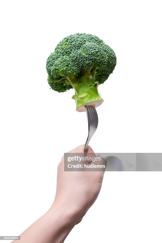 Broccoli on a fork isolated on white background