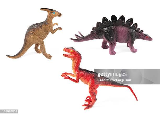 toy dinosaurs on white - dinosaur stock pictures, royalty-free photos & images
