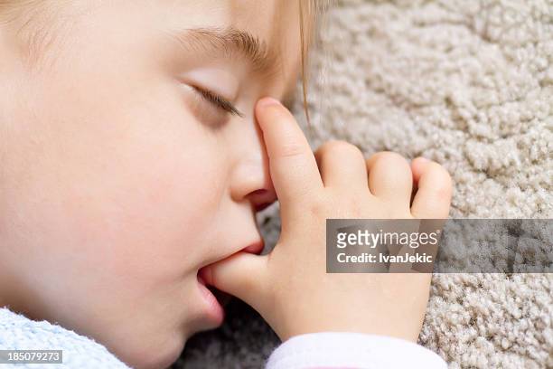 toddler asleep and sucking thumb - thumb sucking stock pictures, royalty-free photos & images