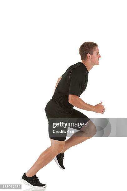 profile of a sports man running - ordinary guy stock pictures, royalty-free photos & images