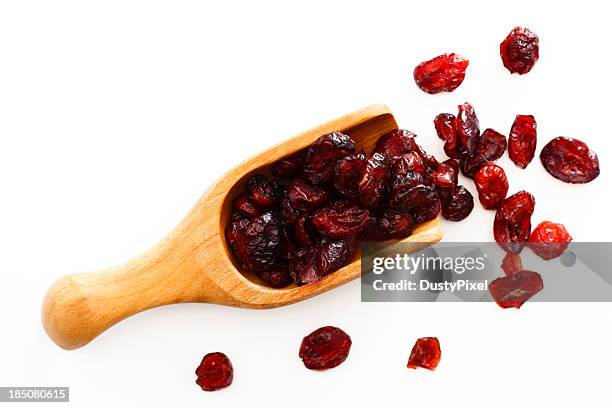 scoop of cranberries - dried food stock pictures, royalty-free photos & images