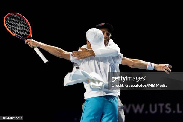 Diego Schwartzman of Argentina hugs his coach Mariano Zabaleta after winning the first match against Benoit Paire of France on Day One at ExCel...