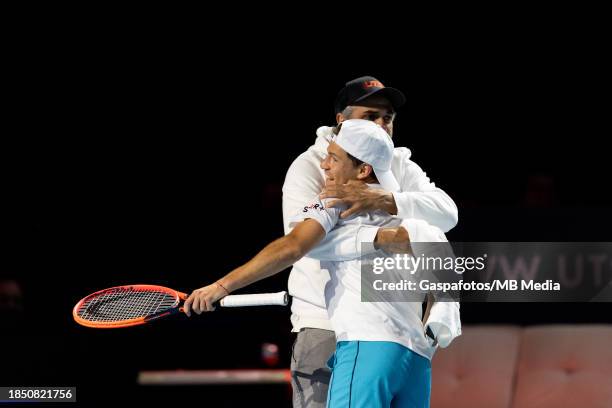 Diego Schwartzman of Argentina hugs his coach Mariano Zabaleta after winning the first match against Benoit Paire of France on Day One at ExCel...