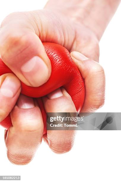 hand squeezing stress ball - stress ball stock pictures, royalty-free photos & images