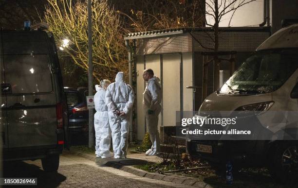 December 2023, Baden-Württemberg, Bietigheim-Bissingen: Police forensic experts work at the site where two bodies were found. Two bodies were found...