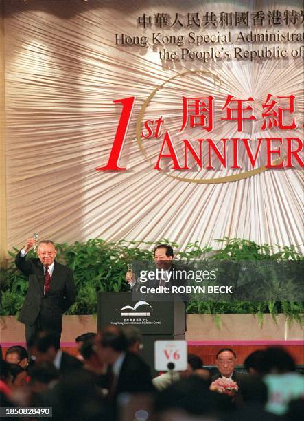 Hong Kong Chief Executive Tung Chee Hwa and Chinese Vice Premier Qian Qichen call for a toast at a banquet gathering to celebrate the first...