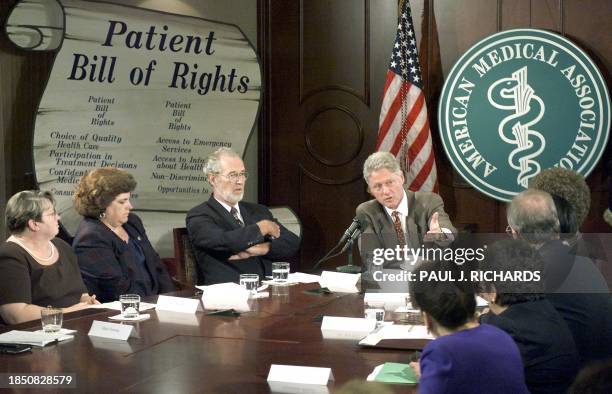 President Bill Clinton listens to shocking and dismal first person details of dealing with health care providers during a Patients Bill of Rights...