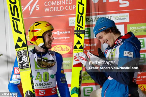 Ilkka Herola of Finland Thomas Rettenegger of Austria share a laugh during a joint intermezzo at the leader board during the Mass Start at the FIS...
