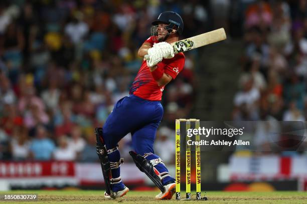 Liam Livingstone of England hits six runs during the 1st T20 International between West Indies and England at Kensington Oval on December 12, 2023 in...