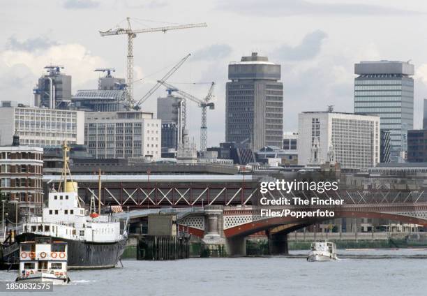 Blackfriar's Bridge and construction cranes over the River Thames in London, circa April 1993.