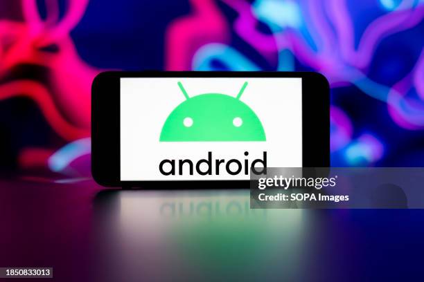 In this photo illustration, the android logo is seen displayed on a mobile phone screen.