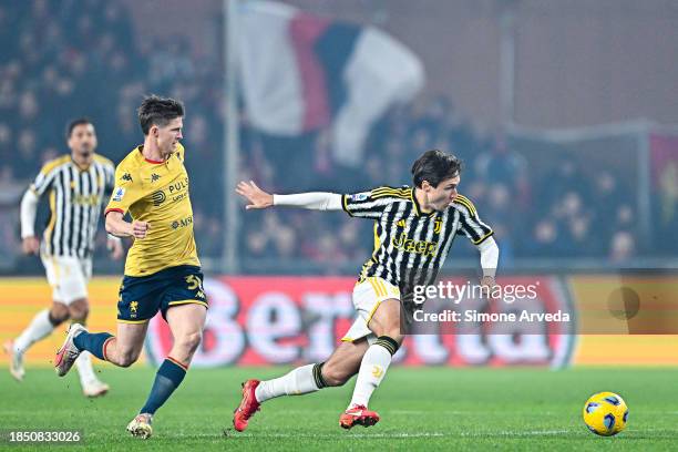 Federico Chiesa of Juventus and Morten Frendrup of Genoa vie for the ball during the Serie A TIM match between Genoa CFC and Juventus at Stadio Luigi...