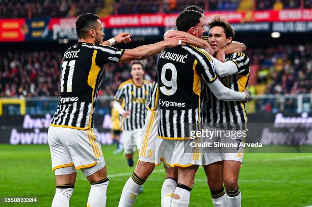 Federico Chiesa of Juventus celebrates with his team-mates after scoring a goal on a penalty kick during the Serie A TIM match between Genoa CFC and...