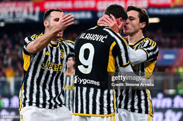 Federico Chiesa of Juventus celebrates with his team-mates Federico Gatti and Dusan Vlahovic after scoring a goal on a penalty kick during the Serie...