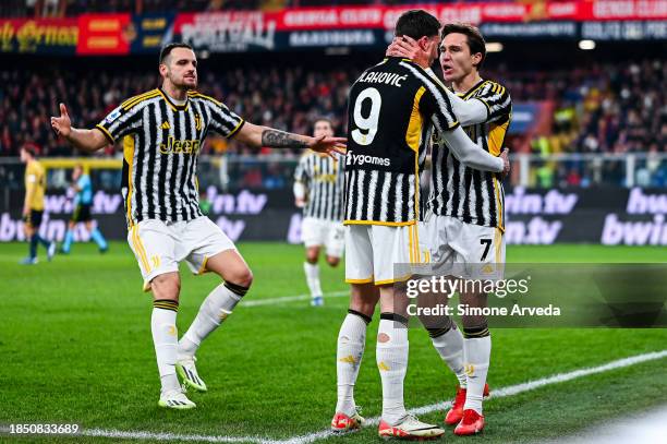 Federico Chiesa of Juventus celebrates with his team-mates Federico Gatti and Dusan Vlahovic after scoring a goal on a penalty kick during the Serie...