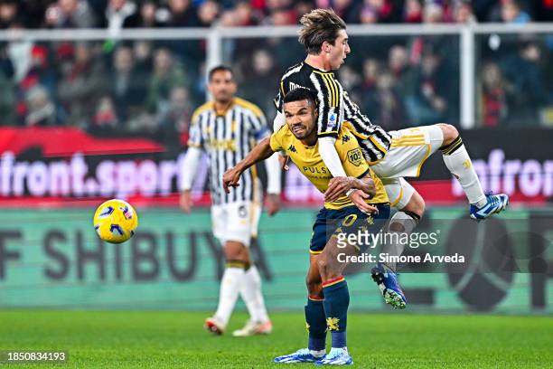 Junior Messias of Genoa and Fabio Miretti of Juventus vie for the ball during the Serie A TIM match between Genoa CFC and Juventus at Stadio Luigi...