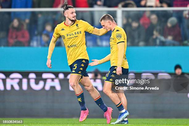 Albert Gudmundsson of Genoa celebrates with his team-mate Radu Dragusin after scoring a goal during the Serie A TIM match between Genoa CFC and...