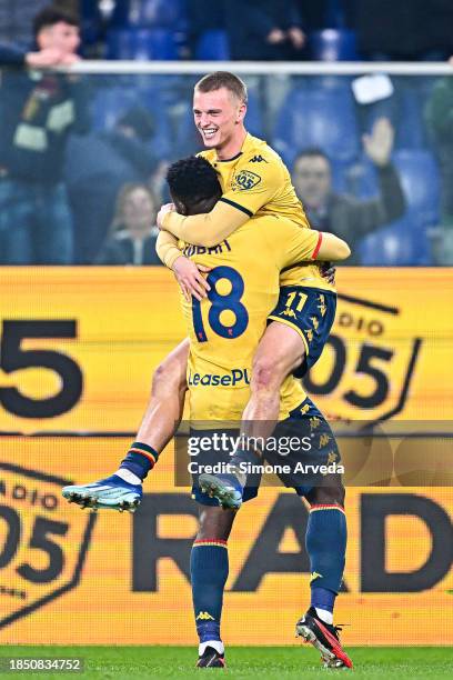 Albert Gudmundsson of Genoa celebrates with his team-mate Caleb Ekuban after scoring a goal during the Serie A TIM match between Genoa CFC and...
