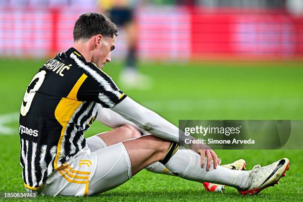 Dusan Vlahovic of Juventus sits on the pitch during the Serie A TIM match between Genoa CFC and Juventus at Stadio Luigi Ferraris on December 15,...