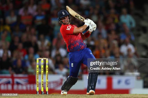 Liam Livingstone of England hits four runs during the 1st T20 International between West Indies and England at Kensington Oval on December 12, 2023...