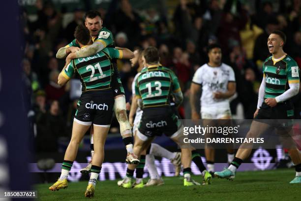 Northampton players celebrate on the final whistle in the European Rugby Champions Cup Pool 3 rugby union match between Northampton Saints and Toulon...