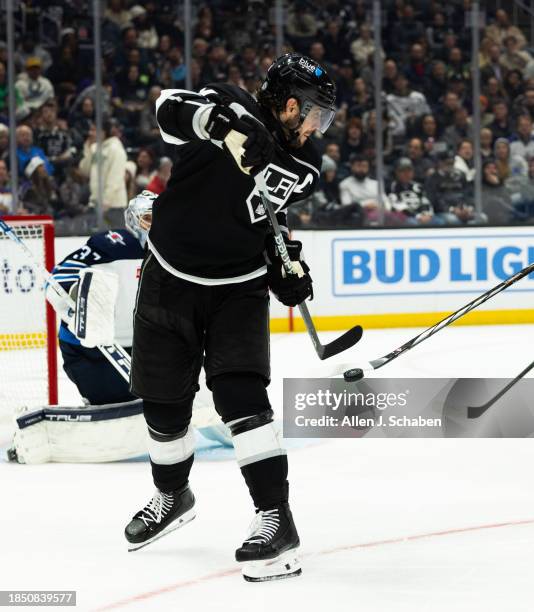 Los Angeles, CA Kings center Anze Kopitar moves the puck away from Winnipeg Jets defenders at Crypto.com Arena in Los Angeles Wednesday, Dec. 13,...