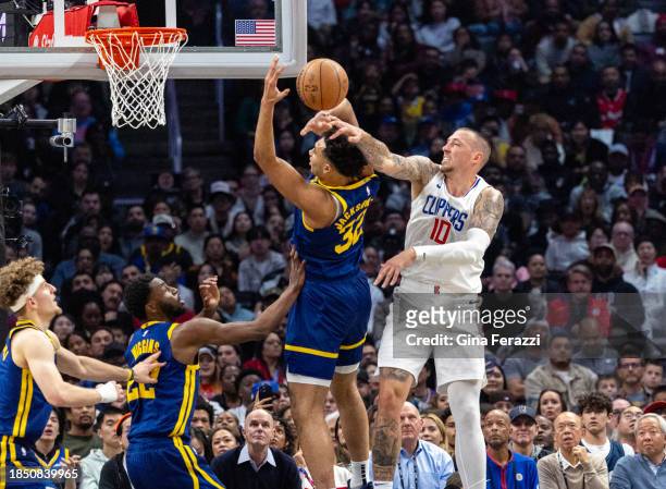 Clippers center Daniel Theis goes for the block on Golden State Warriors forward Trayce Jackson-Davis in the first half at Crypto.com Arena on...