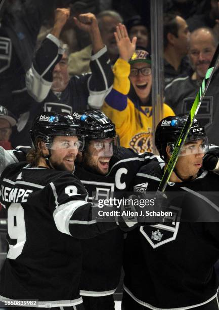 Los Angeles, CA Kings fans and Kings right wings Adrian Kempe, left, and Quinton Byfield, right, celebrate Kings center Anze Kopitar, center, goal...