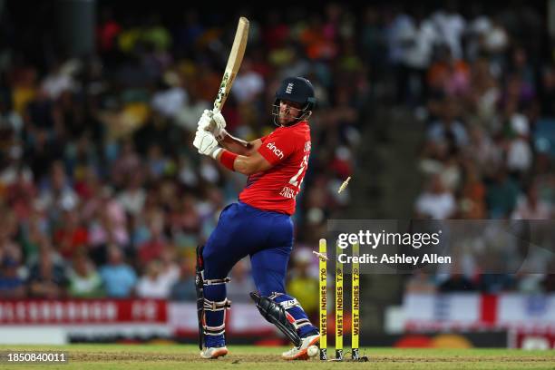 Liam Livingstone of England is bowled by Andre Russell of West Indies during the 1st T20 International between West Indies and England at Kensington...