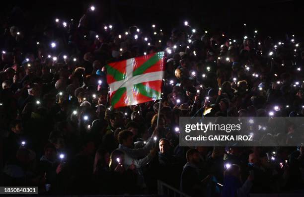 Bayonne's supporters wave a Basque flag and lighting up with their cell phones prior to the European Champions Cup first round day 2 group C Rugby...
