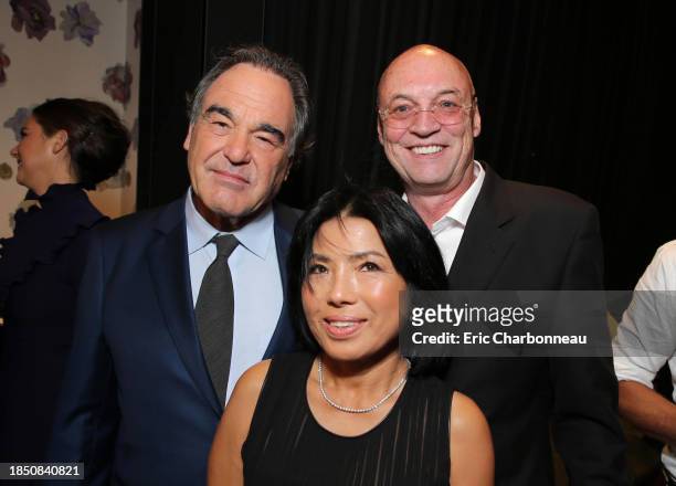 Director Oliver Stone, Sun-jung Jung and Producer Moritz Borman are seen at Audi and Nespresso co-host the official pre-party for Open Road Films'...