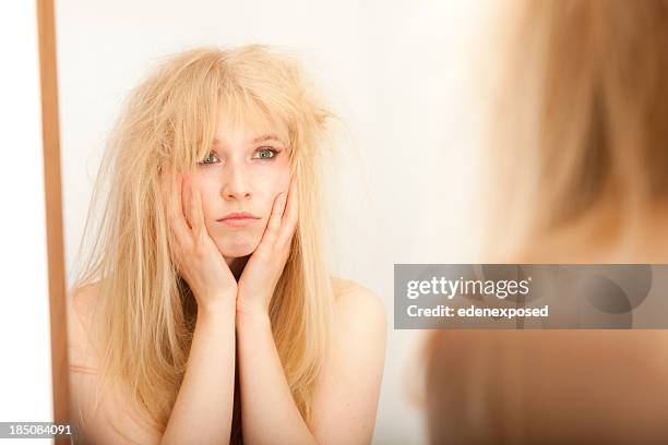 müde frau mit ihr haar - dry hair stock-fotos und bilder