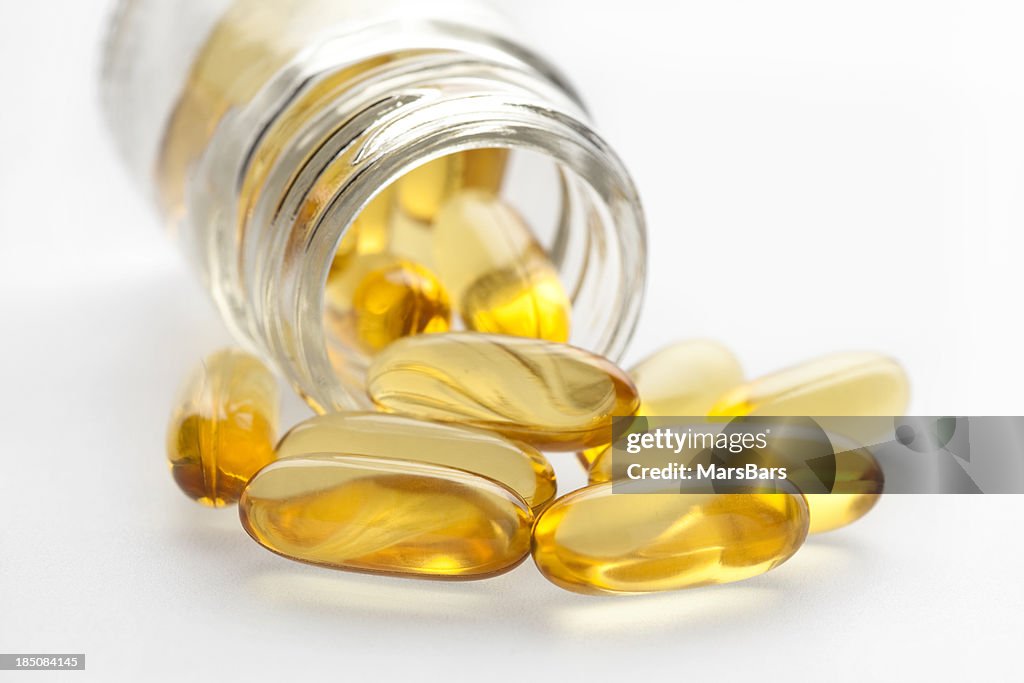 Omega 3 fish oil capsules and bottle