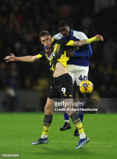Mileta Rajovic of Watford jumps for the ball with Axel Tuanzebe of Ipswich Town during the Sky Bet Championship match between Watford and Ipswich...