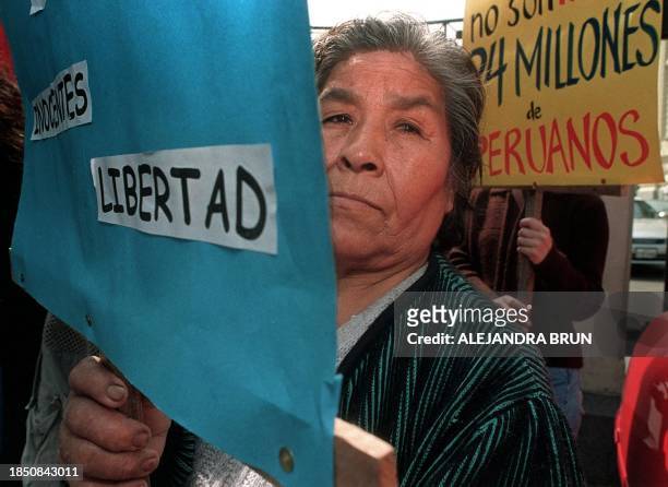 Woman from a human rights organization demonstrates 07 July 1999 in Lima. Una mujer de una organizacion de Derechos Humanos protesta el 07 de Julio...