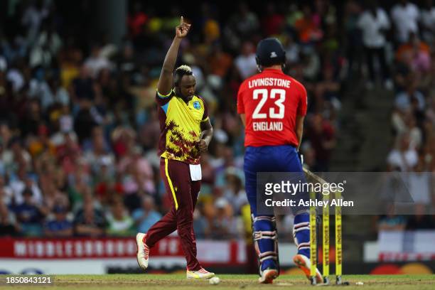 Andre Russell of West Indies celebrates getting the wicket of Liam Livingstone of England during the 1st T20 International between West Indies and...
