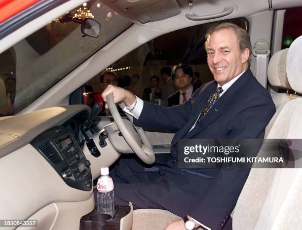 James Miller, president of Mazda, sits on the driving seat of the company's redesigned minivan, the new MPV during its press preview at a hotel in...