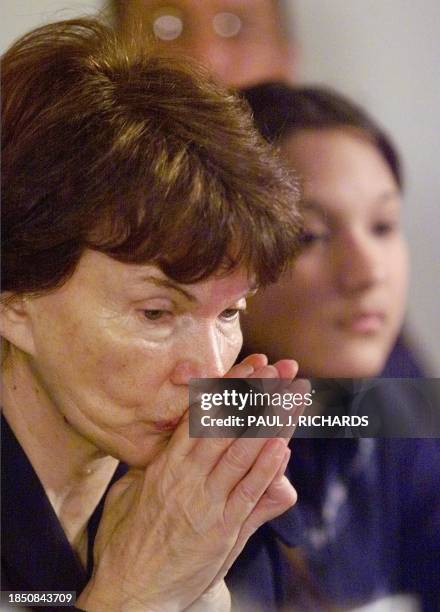 France's former First Lady Danielle Mitterrand , President of the human rights group "France Libertes" Foundation, listens to the speech of former US...