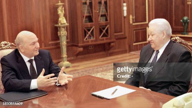 Moscow's mayor Yuri Luzhkov gestures while talking to Russian President Boris Yeltsin during their talks at Moscow's Kremlin, 13 April 1999. The two...