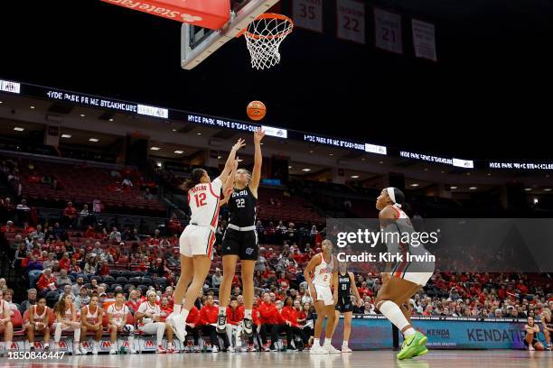 Ava Scanlon of the Grand Valley State Lakers shoots the ball while being defended by Celeste Taylor of the Ohio State Buckeyes during the first half...